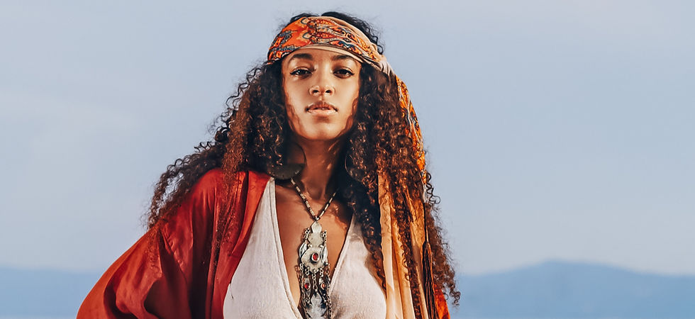 Beautiful young stylish woman on the bea