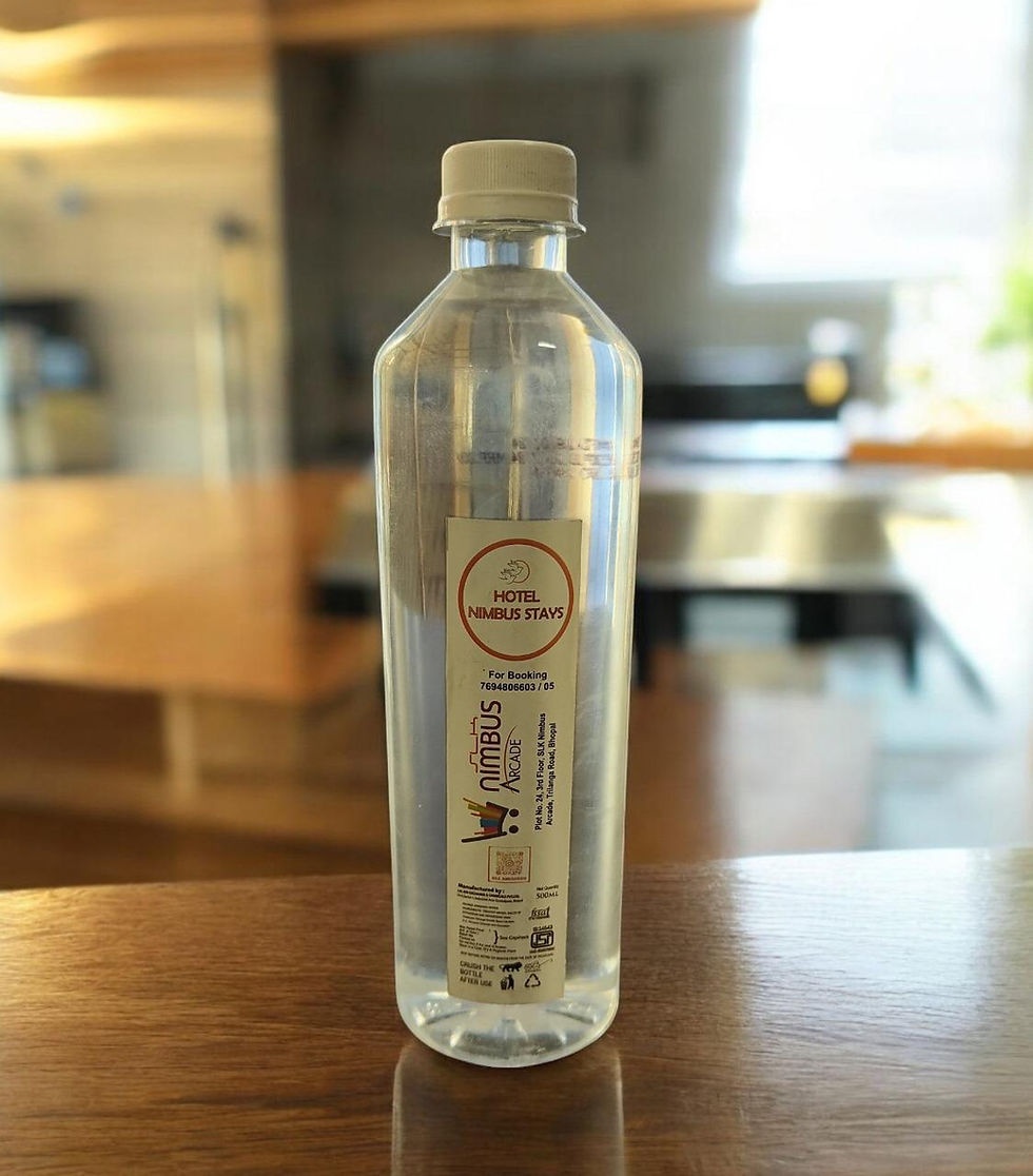 Thumbnail: Clear glass bottle of zen water on a wooden table.