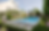 Backyard pool design with spa and contemporary concrete steppers surrounded by flowering plants
