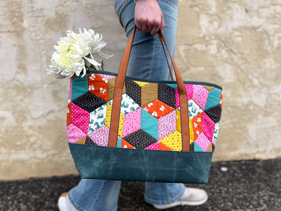 Medium Everday Altoona Tote with custom-quilted cotton upper and waxed canvas base, being carried