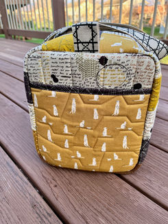 End view of quilted duffel bag.
