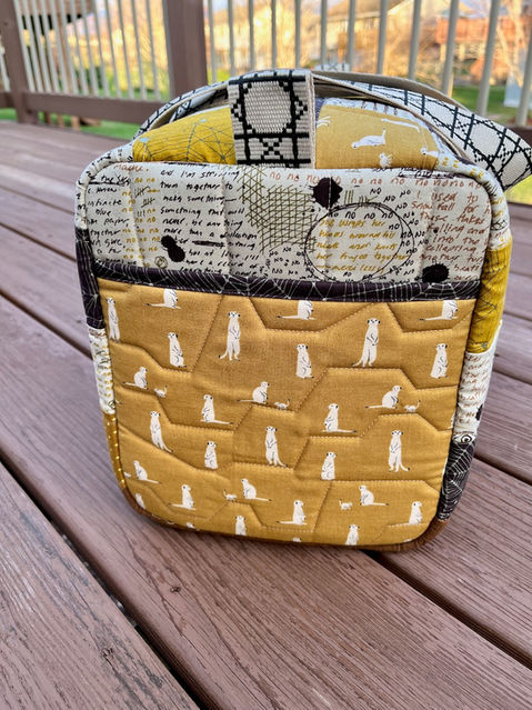 End view of quilted duffel bag.