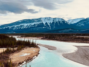 River running along mountains in Canada