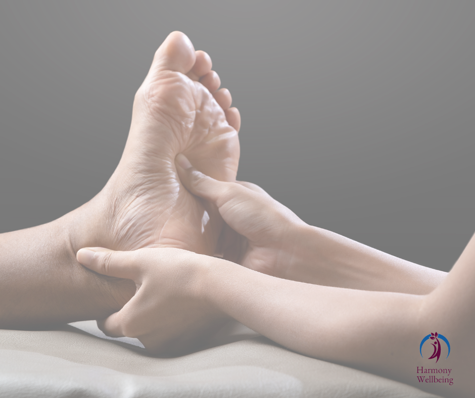 A foot receiving a reflexology treatment
