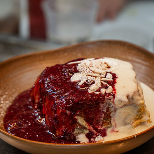French toast covered in vanilla cream and berries