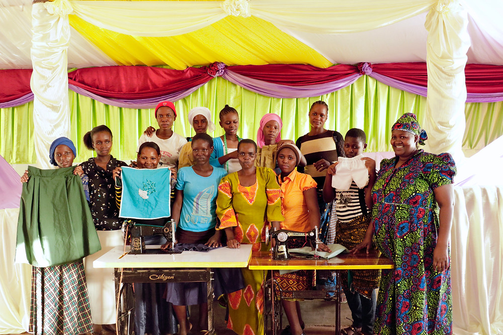 KiliTech sewing group posing with the Maua decorations