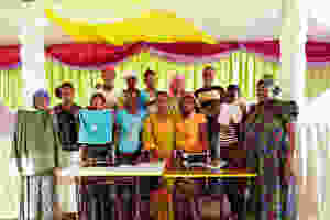 KiliTech sewing group posing with the Maua decorations