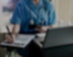 healthcare professional writing on a document, sedna public sector