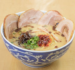 Steaming bowl of ramen with chashu pork