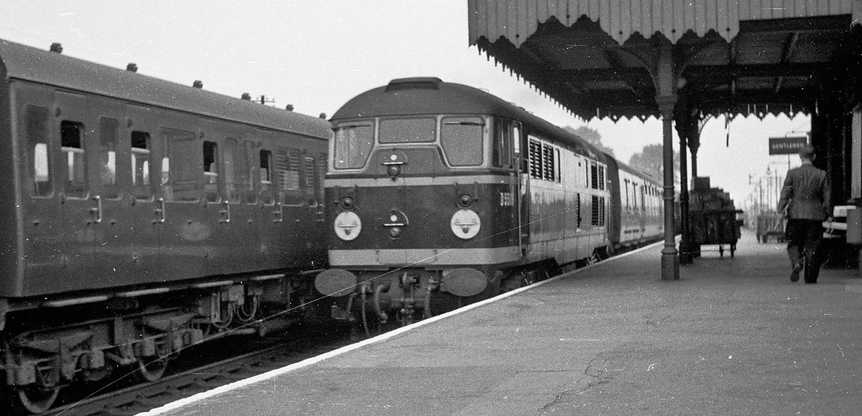 Brush Type 2 No D5519 calls at Ponders End with a stopping train to Liverpool Street on 21 August 1959.