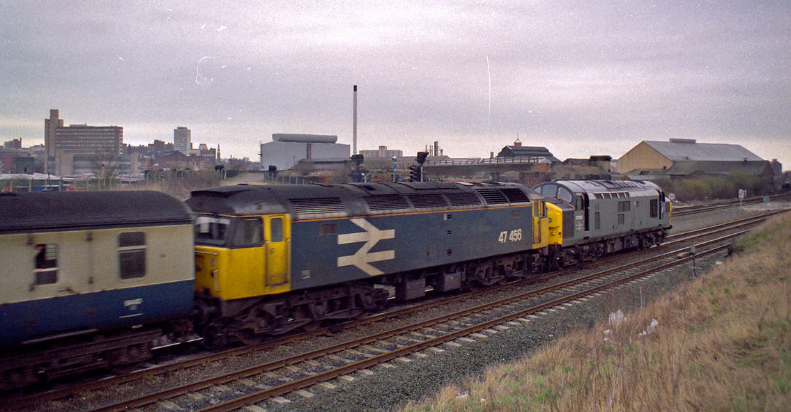 Class 37 No 37104 and Class 47 No 47456 head the 2E24 12.42 Carlisle - Leeds through Holbeck on 10 March 1989.