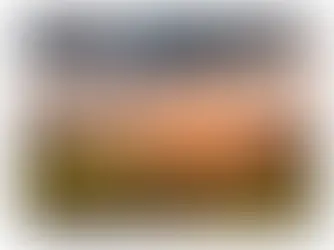Titelbild Allgäukalender 2027 von Benjamin Zapf Fotografie, das das Dorf Rettenberg im Sonnenuntergang zeigt.