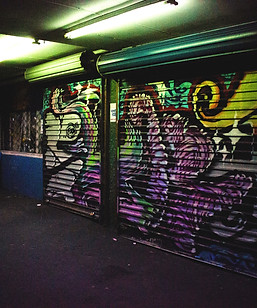 dimmed lighted alley with graffitis_edit