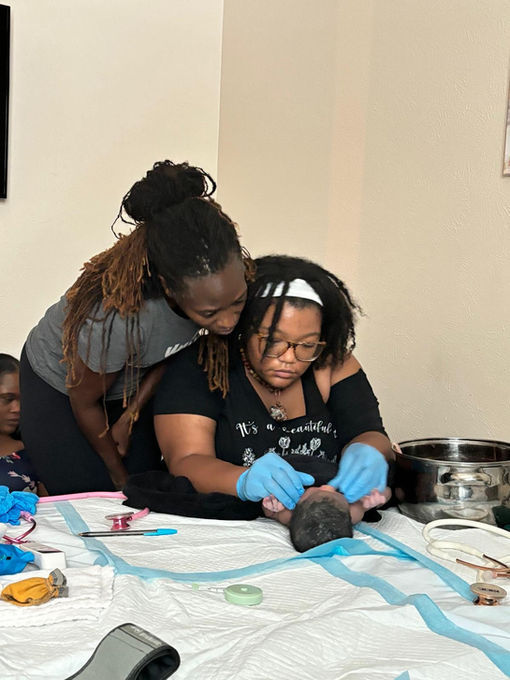 Two women in a medical training session