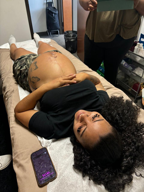Pregnant woman lying on examination table
