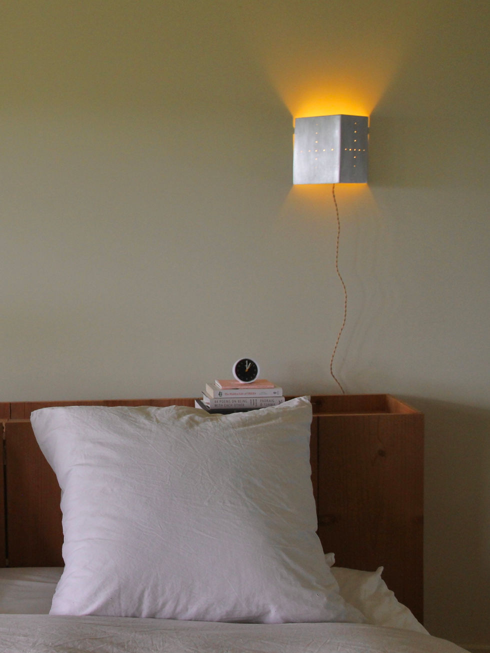 Thumbnail: cross pinhole sconce