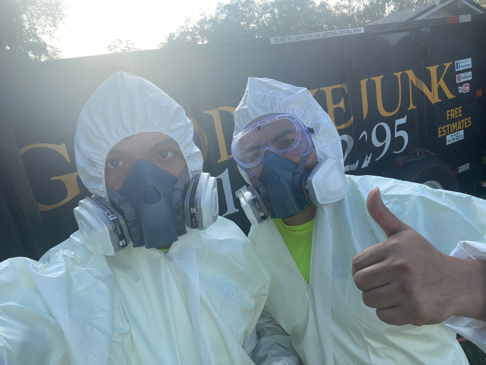 The Goodbye Junk team preparing for a hoarder house cleanout.