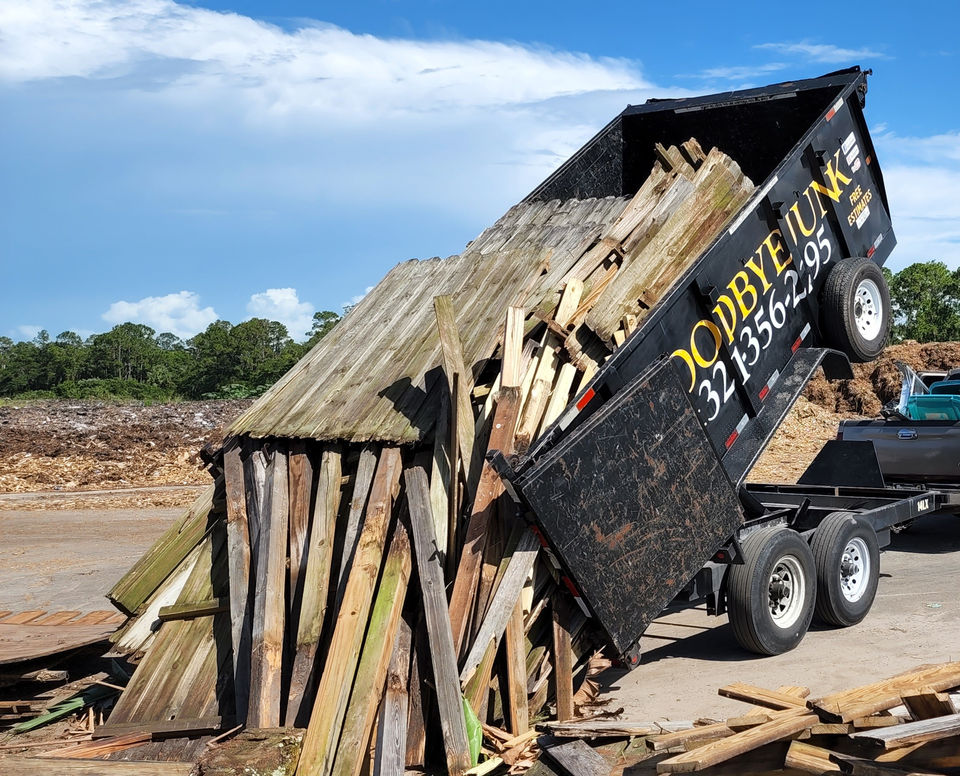 Full trailer load of panels & poles being disposed