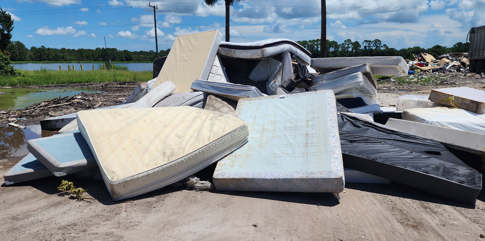 Multitude amount of mattresses from a variety of sizes being properly disposed.