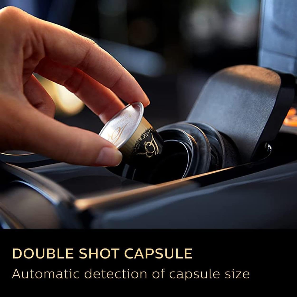 Hand inserting double shot capsule into L'OR Barista Philips coffee machine