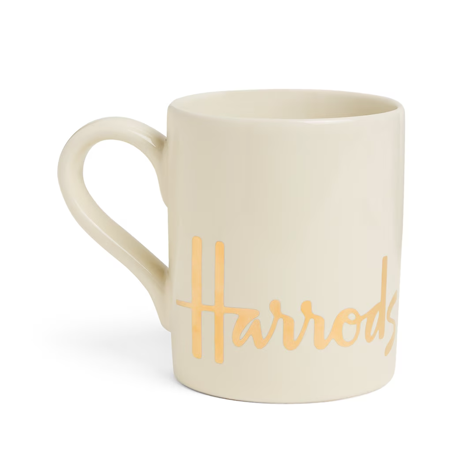 Thumbnail: A classic Harrods mug with a luxurious gold Harrods wordmark, perfect for coffee, tea, or as a souvenir
