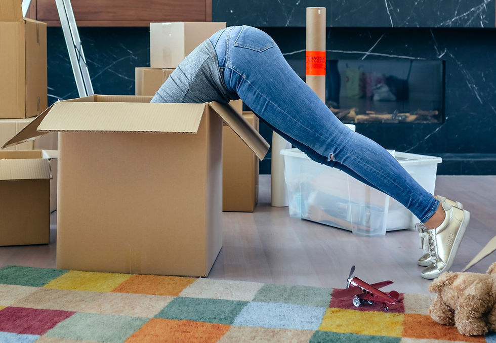 Woman leaning into a packing box