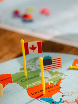 Nên Định Cư Mỹ Hay Canada? So Sánh Toàn Diện Năm 2026