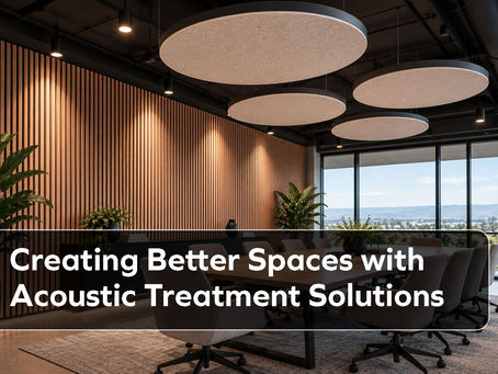 A boardroom with acoustic wooden wall panels and suspended acoustic clouds.
