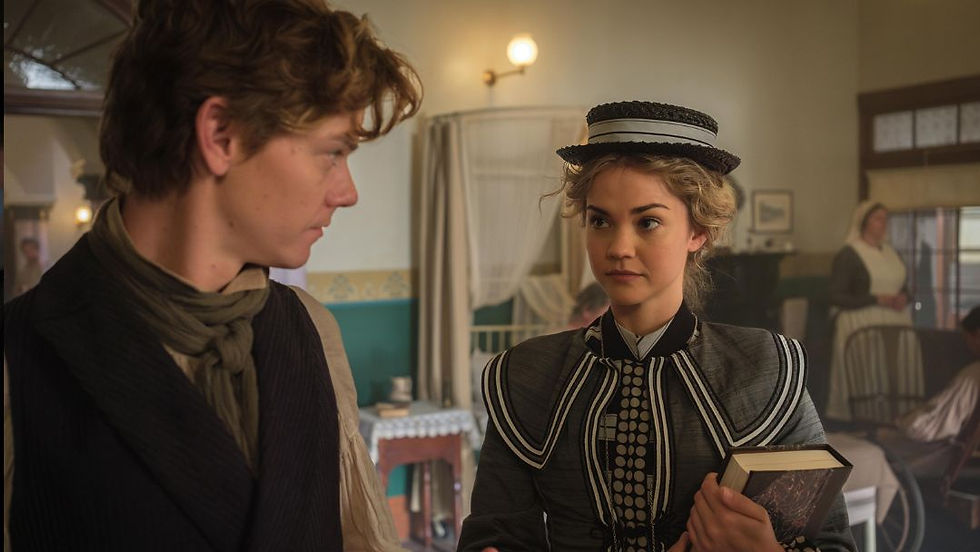Jack Dawkins and Lady Belle Fox discuss medical literature in a colonial hospital, highlighting their partnership in The Artful Dodger Season 2.