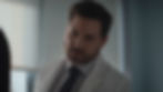 Edgar Ramírez looks intense wearing a white lab coat and tie as surgeon Paolo Macchiarini in the second season of the series Dr. Death.