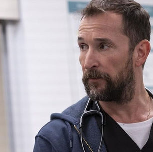  Noah Wyle as Dr. Michael Pittman in medical scrubs. Viewers anticipate The Pitt Season 3 Renewal as the HBO Max series is compared to Grey's Anatomy.