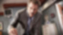 Hugh Laurie leans in with an intense gaze as Dr. Gregory House, capturing an iconic moment in the popular medical drama series House M.D.