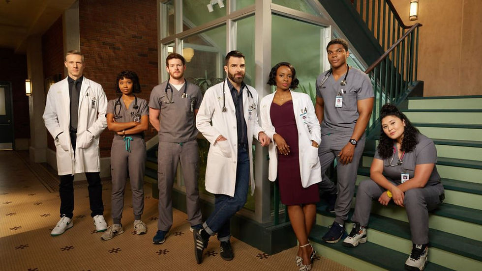 The talented ensemble cast of Brilliant Minds, including Dr. Oliver Wolf, gathered in a hospital setting.