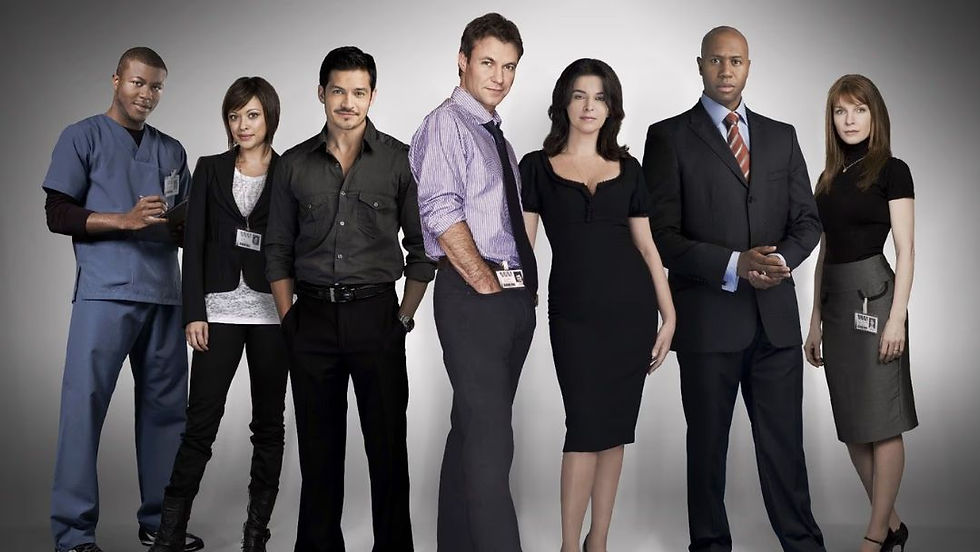 The lead ensemble cast of the Mental TV series 2009, featuring Chris Vance and Annabella Sciorra, posing in professional attire for the Fox medical drama.