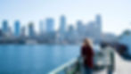 Meredith Grey gazes at the Seattle skyline from a ferry, a quintessential part of Grey's Anatomy filming locations.