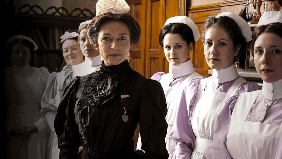 Matron and nursing staff in authentic Edwardian uniforms from the BBC show Casualty 1900s standing in a wood-paneled London Hospital room.