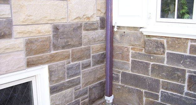 Staining stone masonry on a home