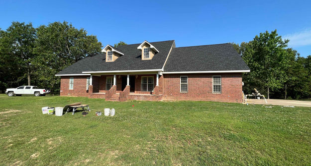 Before whitewash brick home