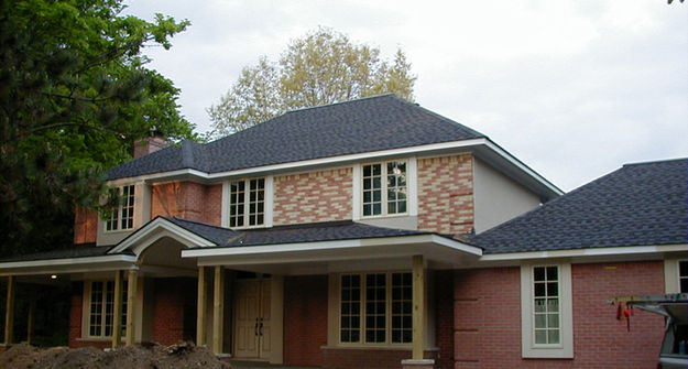Staining brick red on a home