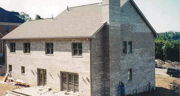 Before staining off-colored bricks on a home