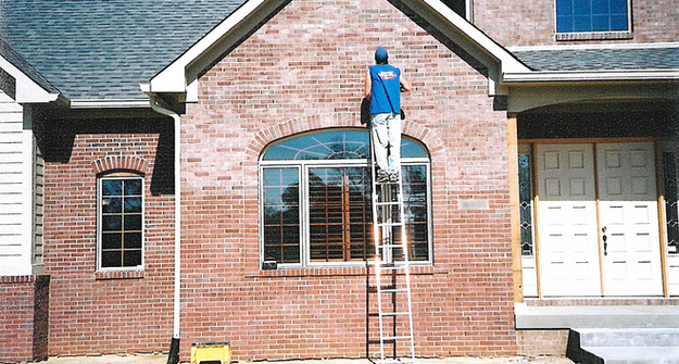 Staining bricks on a house