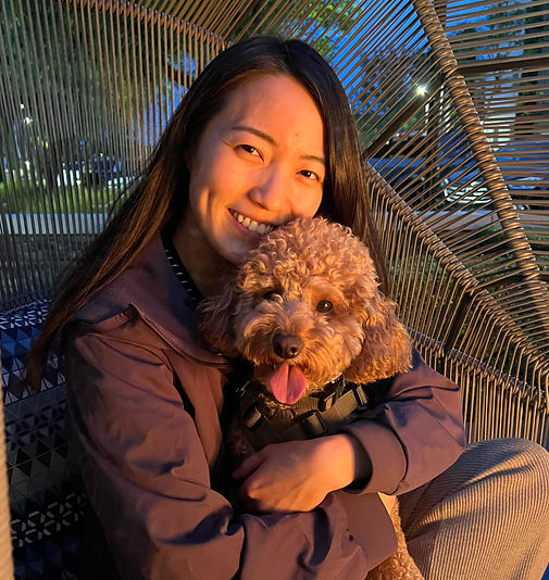 A woman holding her dog