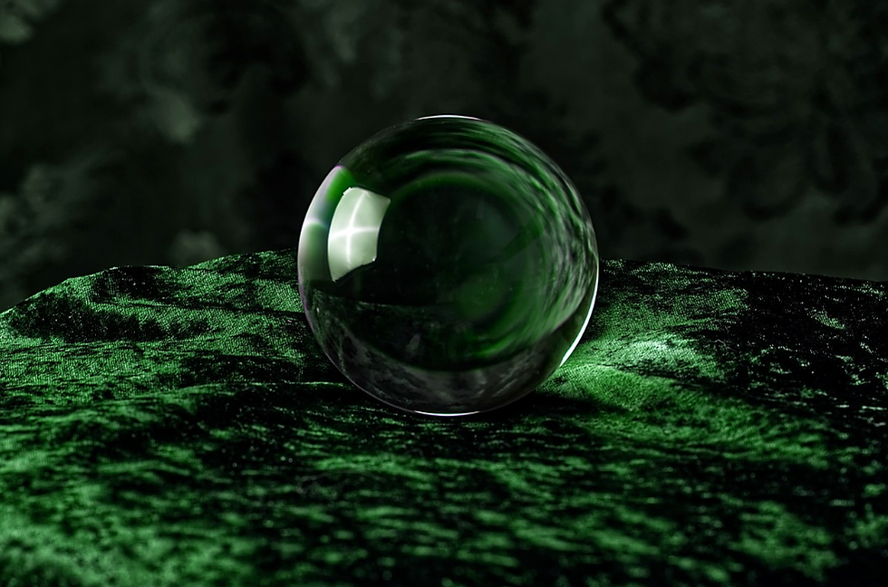 crystal ball on dark green velvet background