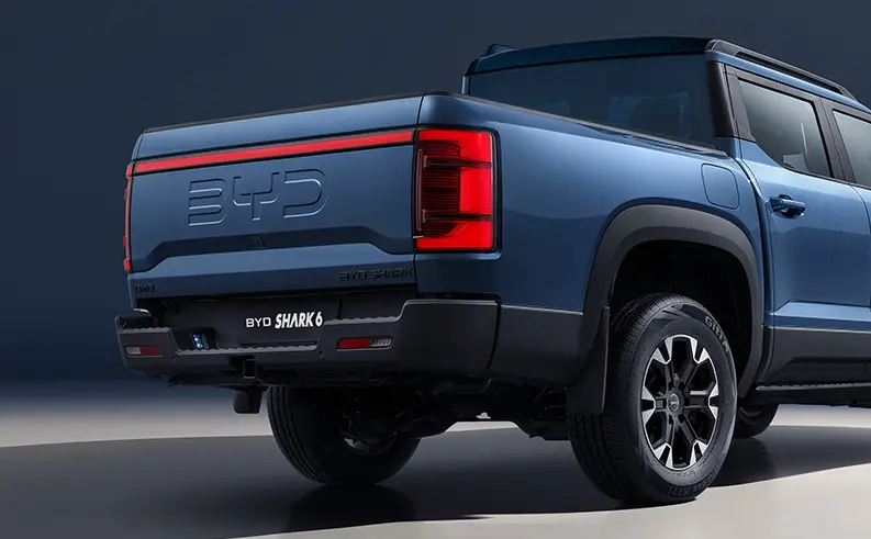Rear view of blue BYD Shark 6 pickup truck