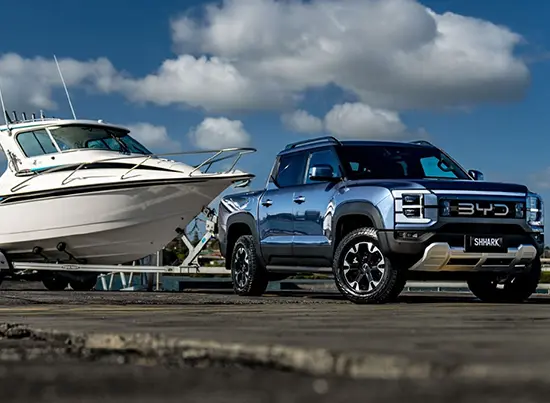 BYD Shark pickup towing a boat