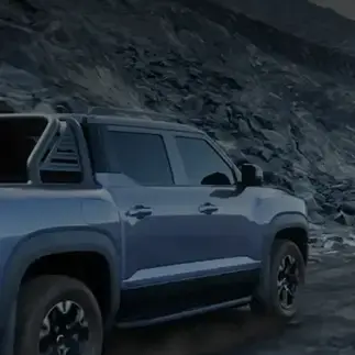 Pickup truck on a rugged mountain path