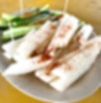 A Simple Appetizer, Jicama & Cucumber Salad with Tajin Spice & Lime sliced on a grey circular plate.