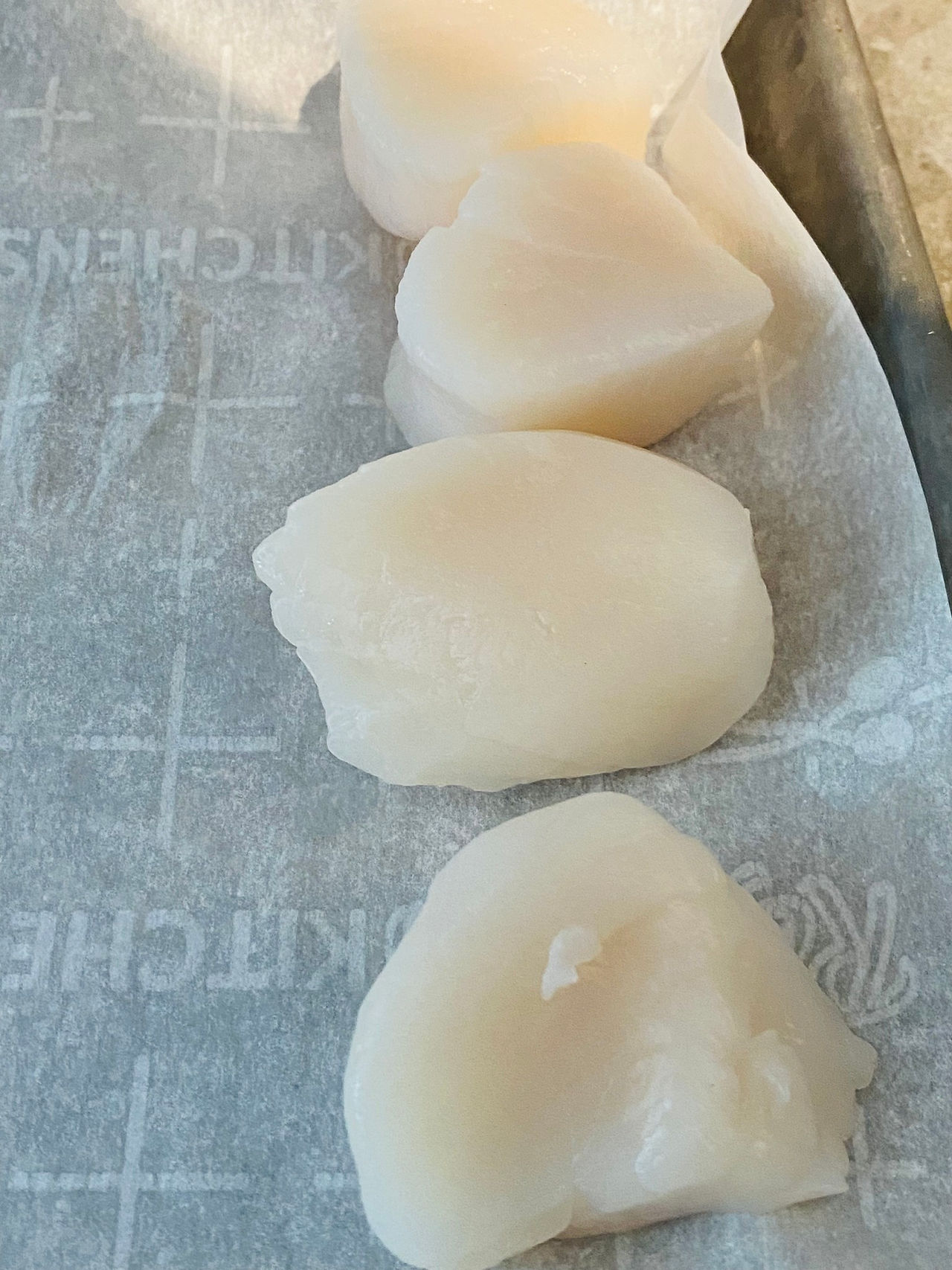 Dover Scallops: Tom's Seafood uncooked on parchment paper.