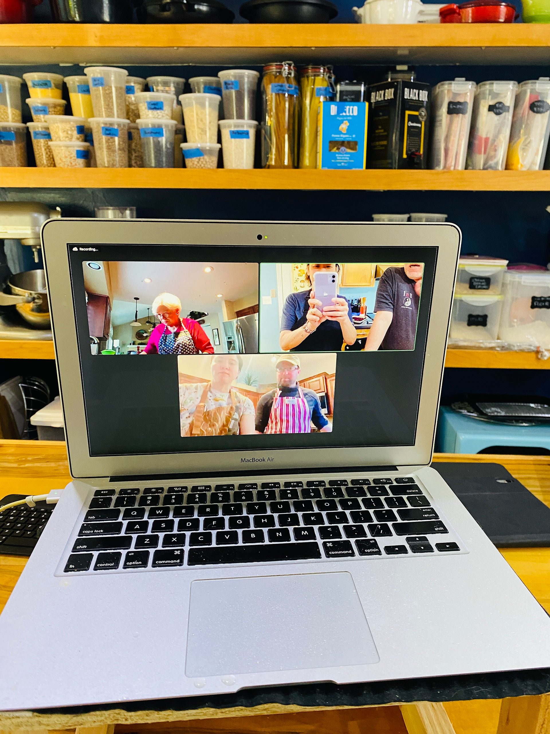 A class of 2 on zoom cooking together on a computer