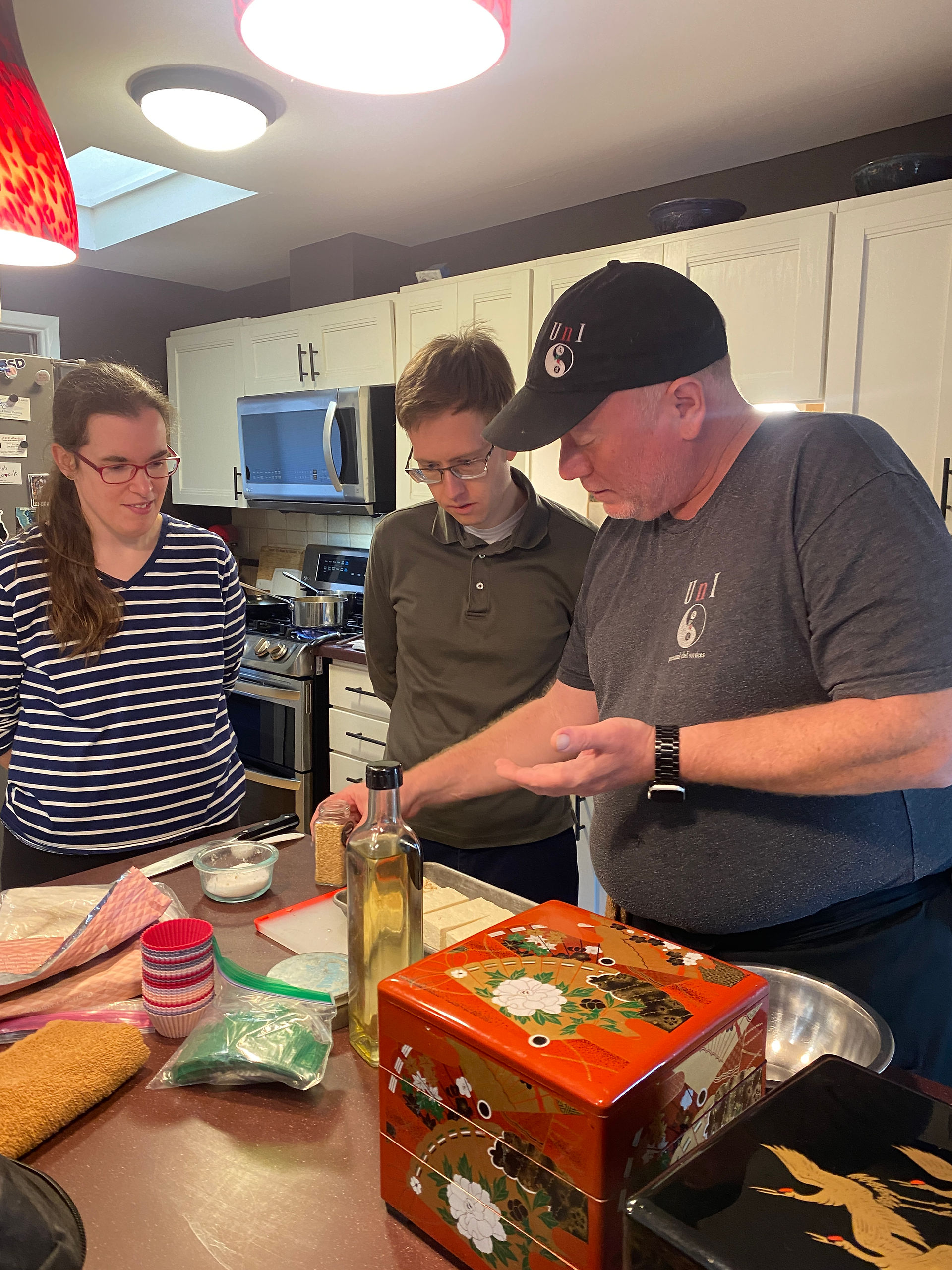First wedding anniversary cooking class with Chef Eric and a couple in a house.